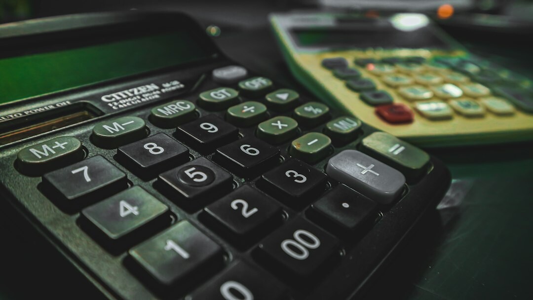 Calculator and tax forms on an office desk